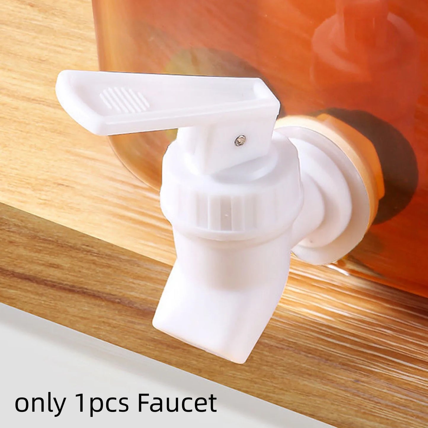 White plastic faucet part of 3.5l refrigerator water dispenser attached to container