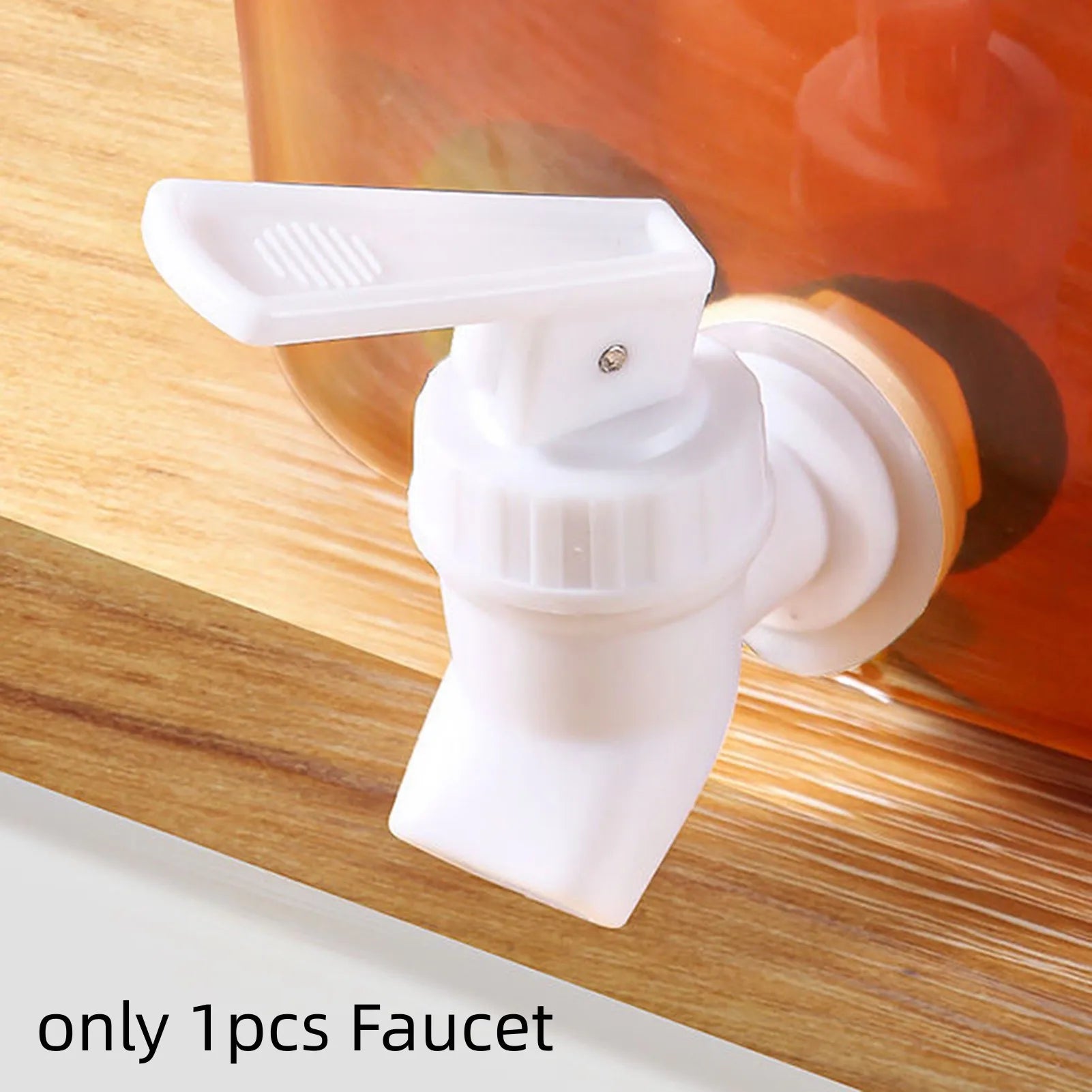 White plastic faucet part of 3.5l refrigerator water dispenser attached to container