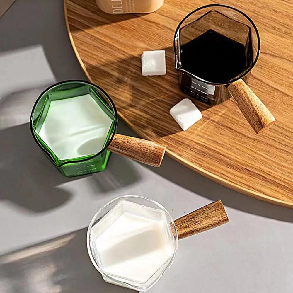 Heat-Resistant Glass Measuring Cup with Wooden Handle for Easy Pouring - Clarify.pk