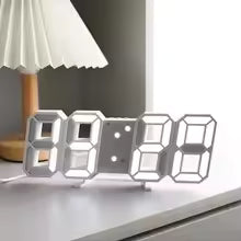 Clarify.pk 3D LED digital wall clock with large white numbers on a modern desk near a lamp
