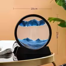 Clarify.pk 3D moving sand art in black circular frame with blue sand on decorative table