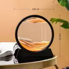 Clarify.pk 3D moving sand art in a circular black frame displayed on a table for home decor