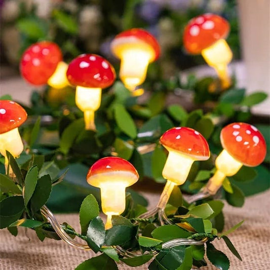 Clarify.pk 3D mushroom string lights with glowing red and white mushroom shapes on a green leafy background