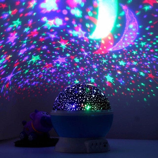 Clarify.pk 3D night light projector displaying colorful stars and moon patterns on a dark wall