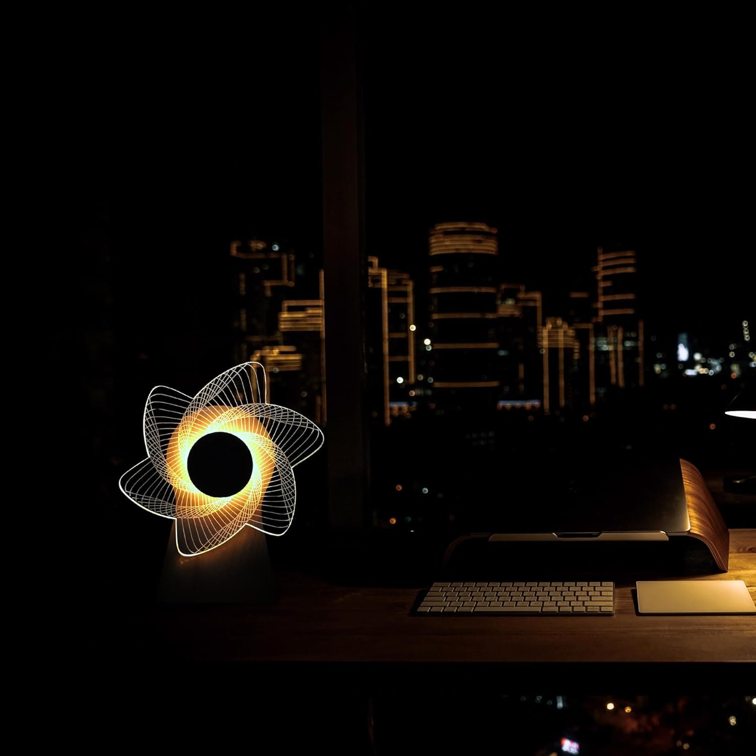 3D windmill night light lamp glowing on desk with city skyline in background at night