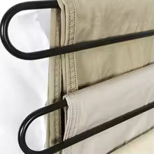 Clarify.pk 5 in 1 pants hanger organizer with black metal rods holding beige and cream pants