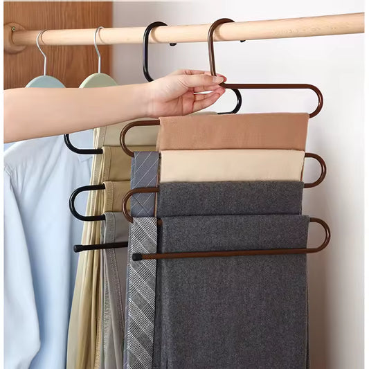 5 in 1 pants hanger organizer by Clarify.pk holding multiple pants neatly on a wooden rod