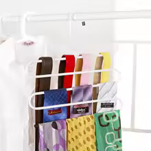 Clarify.pk 5 in 1 pants hanger organizer holding multiple pants in white metal frame