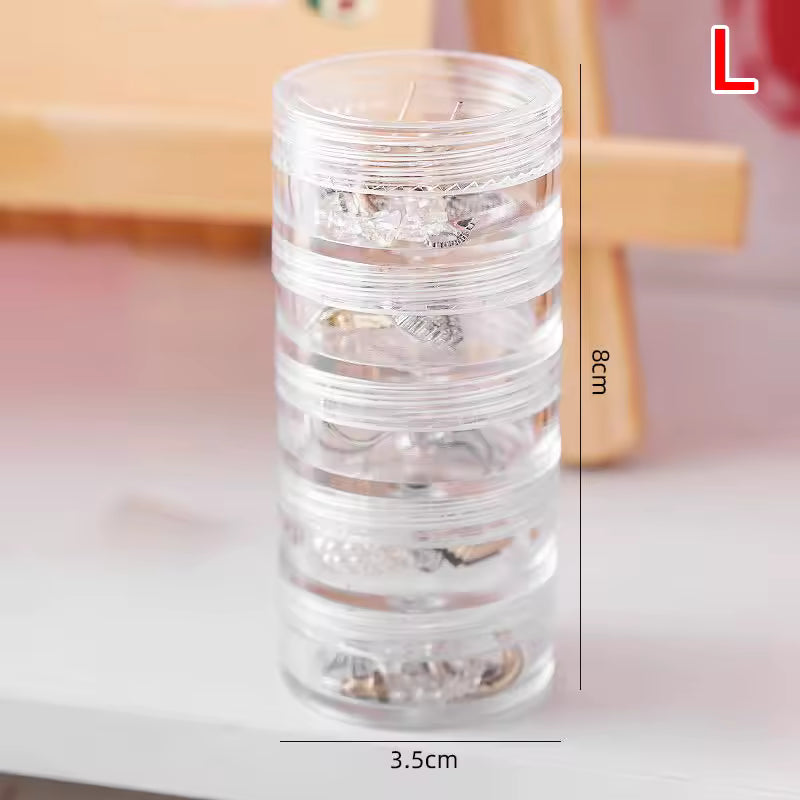 Clear 5 layer jewelry storage box from Clarify.pk with compact cylindrical design for organizing small jewelry