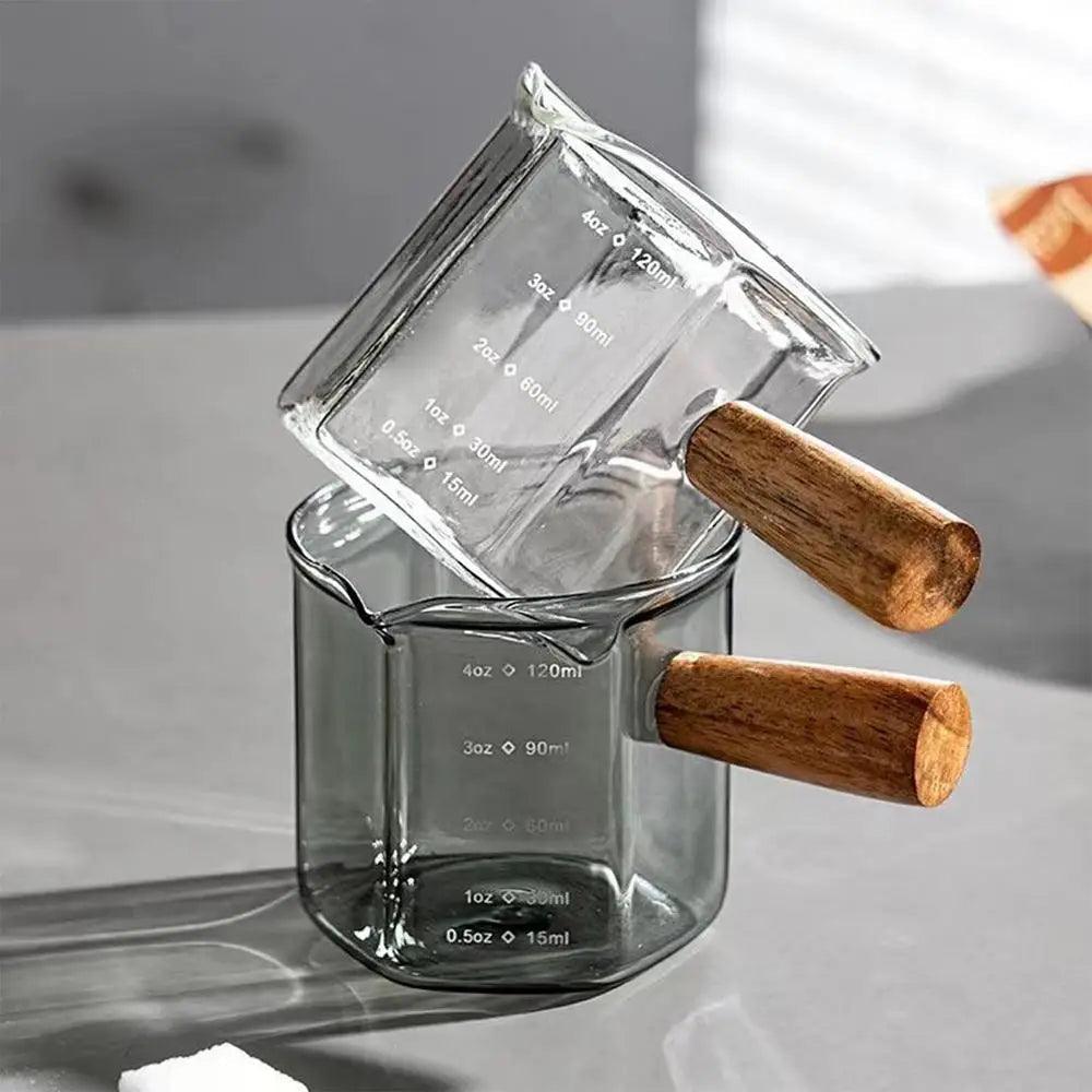 Heat-Resistant Glass Measuring Cup with Wooden Handle for Easy Pouring - Clarify.pk