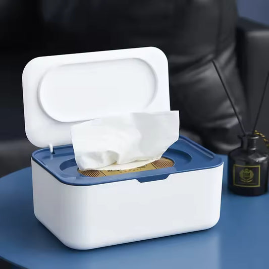 Clarify.pk white and blue wet wipes dispenser with lid holding tissue on blue table