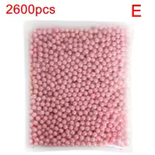 Clear plastic bag filled with 2600 pink beads for acrylic cosmetic organizer storage