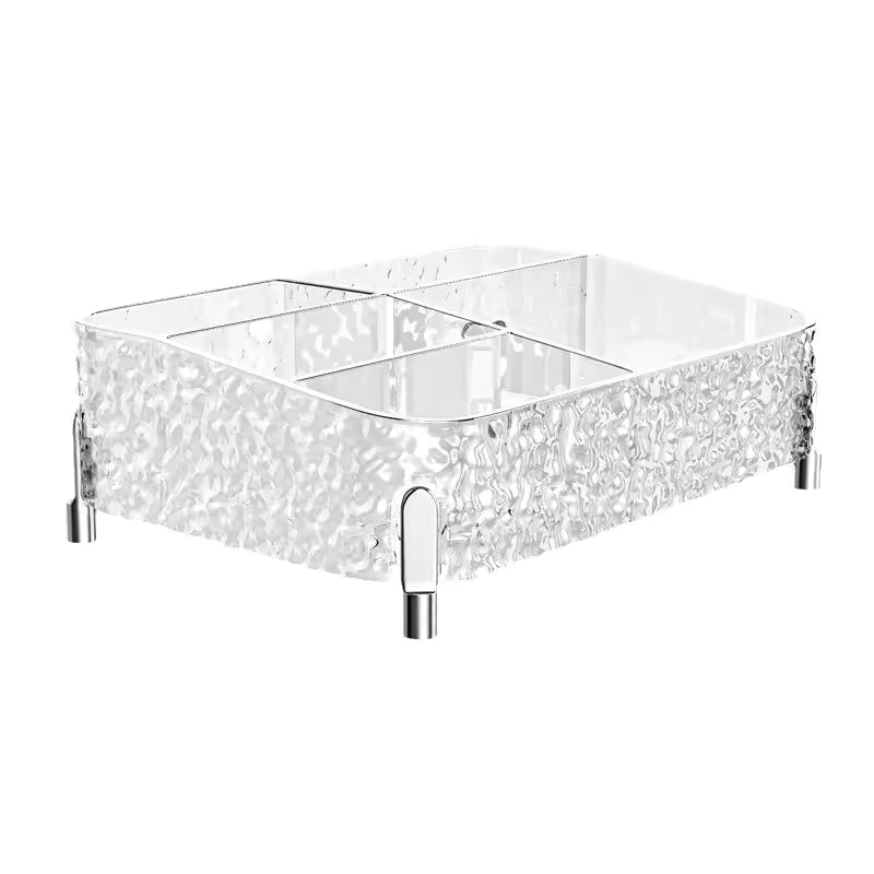 Clear acrylic makeup organizer box with textured sides and multiple compartments for cosmetic storage