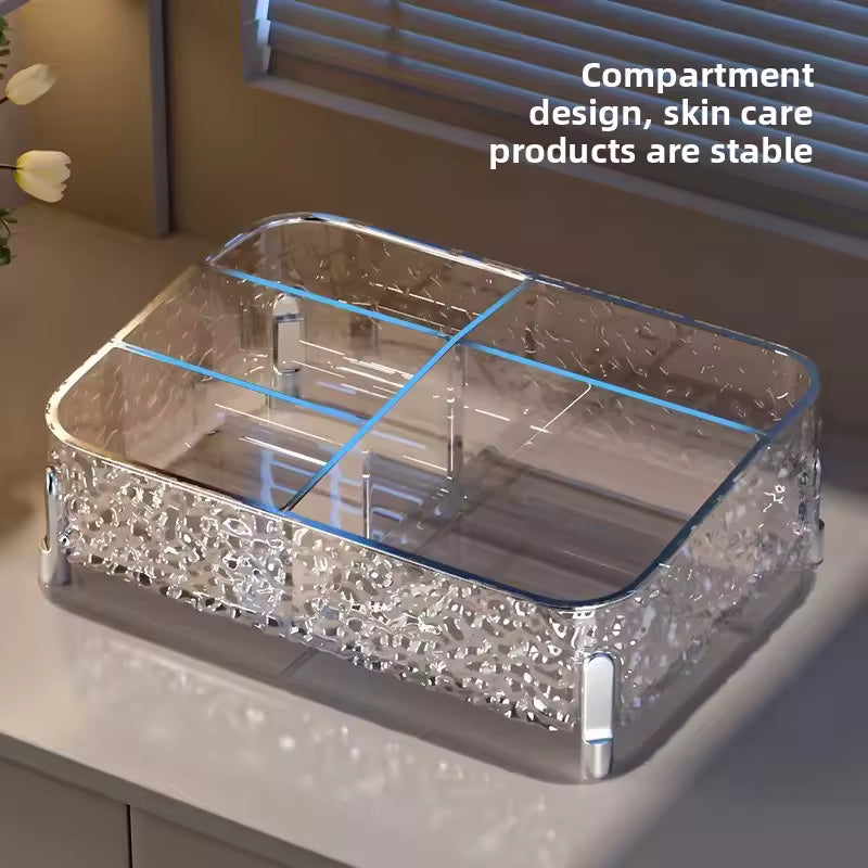 Clear acrylic makeup organizer box with multiple compartments for cosmetic and skincare storage