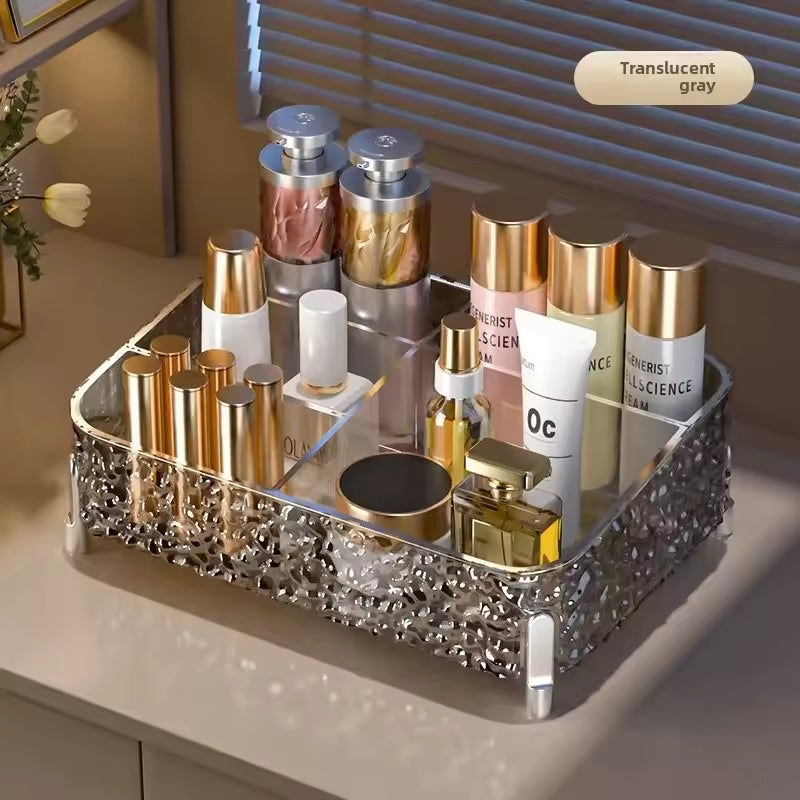 Clarify.pk translucent gray acrylic makeup organizer box with multiple compartments holding cosmetic bottles and lipsticks
