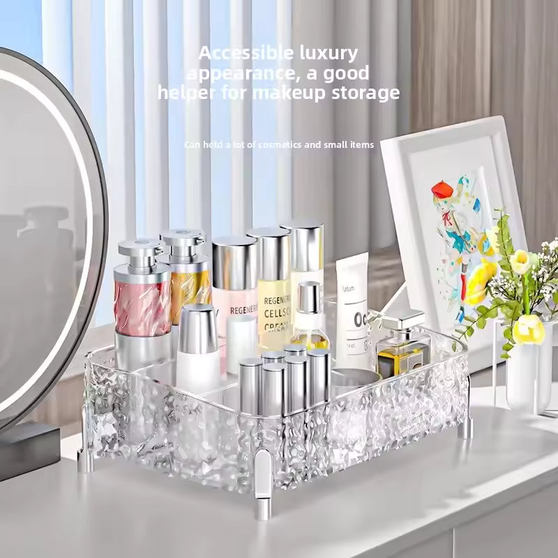Clear acrylic makeup organizer box by Clarify.pk holding various cosmetic bottles and tubes on a vanity table