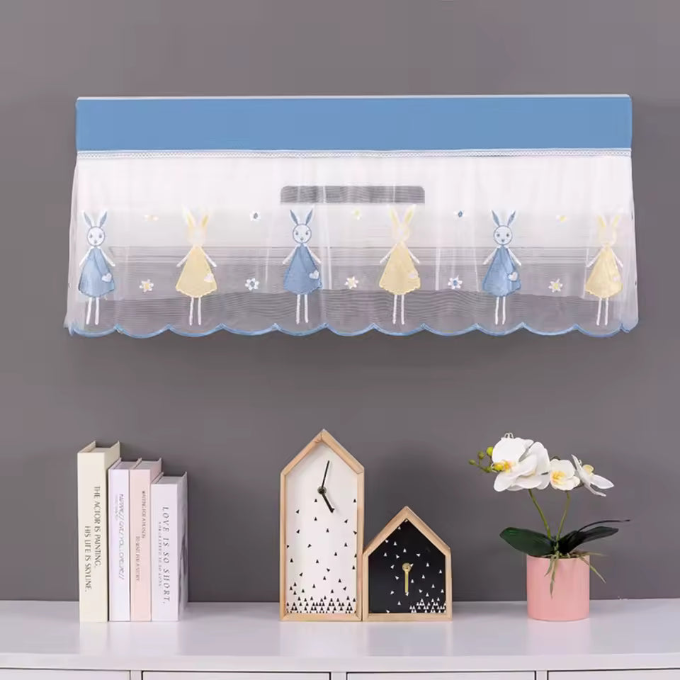Clarify.pk air conditioner dust cover with blue and yellow bunny design, protecting wall-mounted AC unit