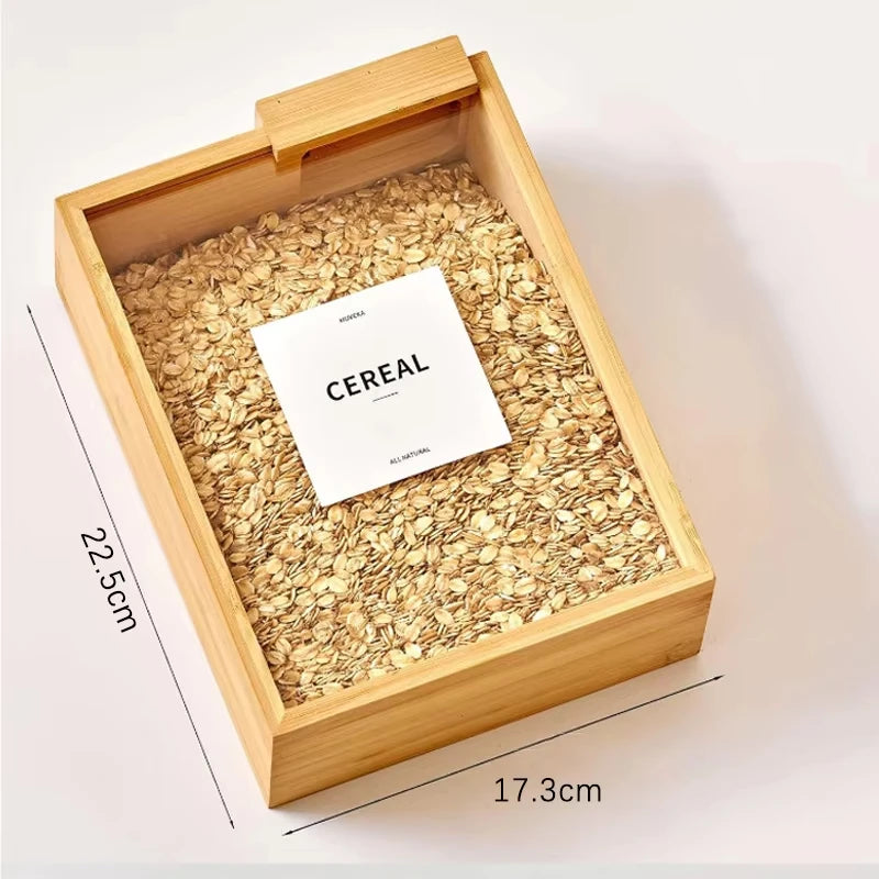 Clarify pk bamboo grain storage box filled with rolled oats and cereal showing sliding lid and dimensions 22 5 cm by 17 3 cm