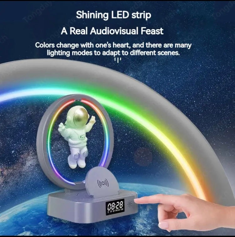 Astronaut night light with bluetooth speaker featuring shining LED strip and digital clock display