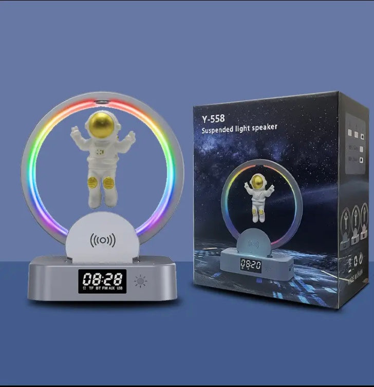 Clarify.pk astronaut night light with bluetooth speaker showing suspended astronaut inside glowing LED ring and digital clock