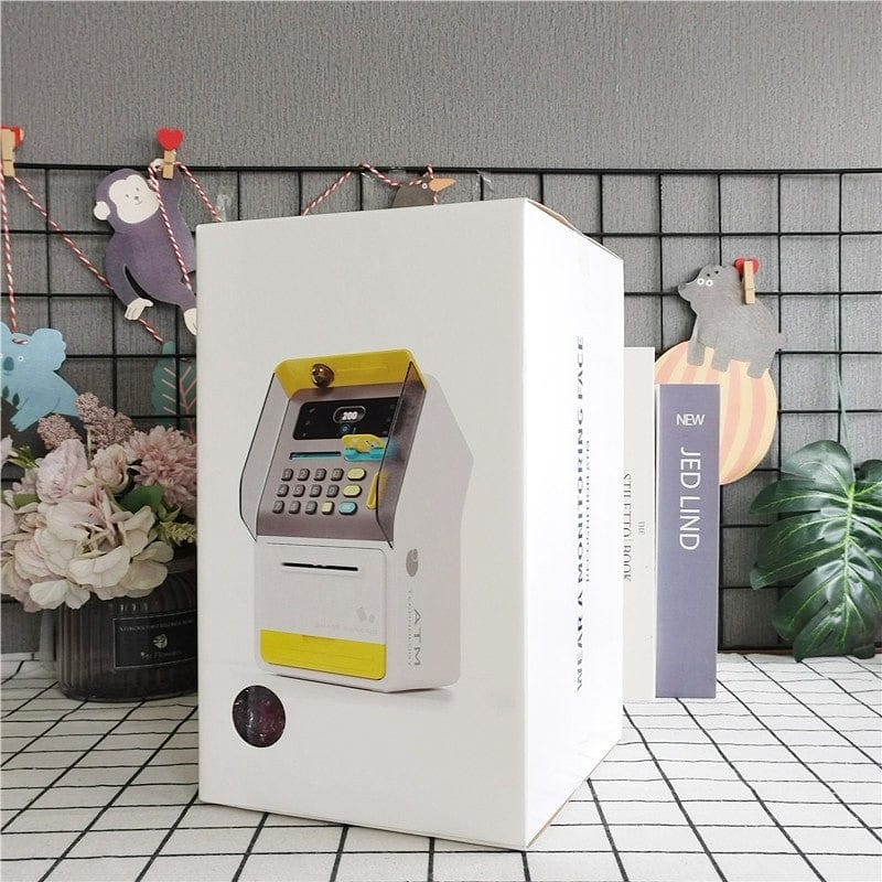 ATM machine money box with code lock in white and yellow displayed on a retail box by Clarify.pk