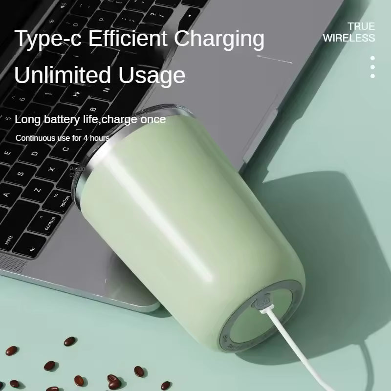 Clarify.pk automatic self stirring mug charging via Type-C next to laptop with coffee beans nearby