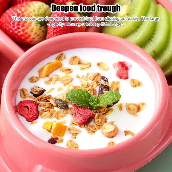 Pink 4 compartment plastic dinner plate with central bowl of yogurt and granola and fruit sections