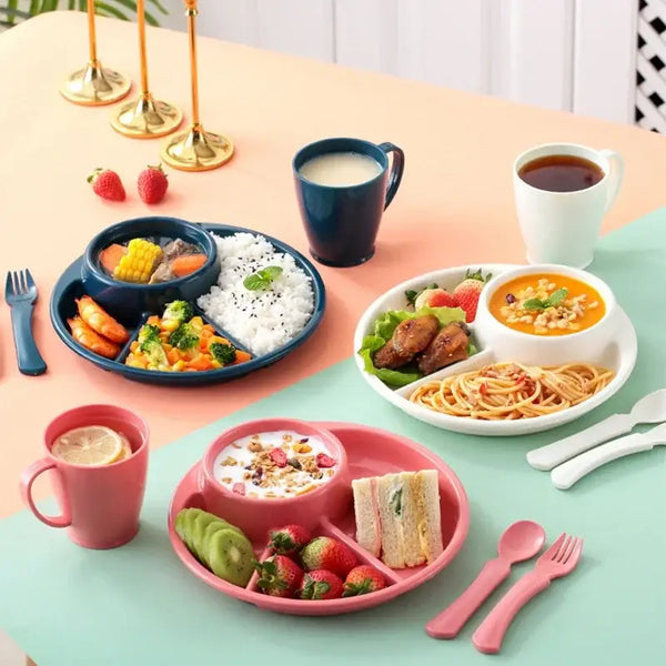 4 compartment plastic dinner plate set in pink white and blue with meals fruits sandwiches utensils