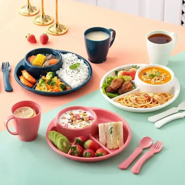 4 compartment plastic dinner plate set in pink white and blue with rice spaghetti salad fruit and soup