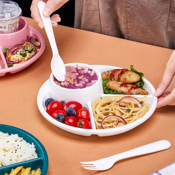 White 4 compartment plastic dinner plate with soup bowl and sections of grilled chicken pasta and berries