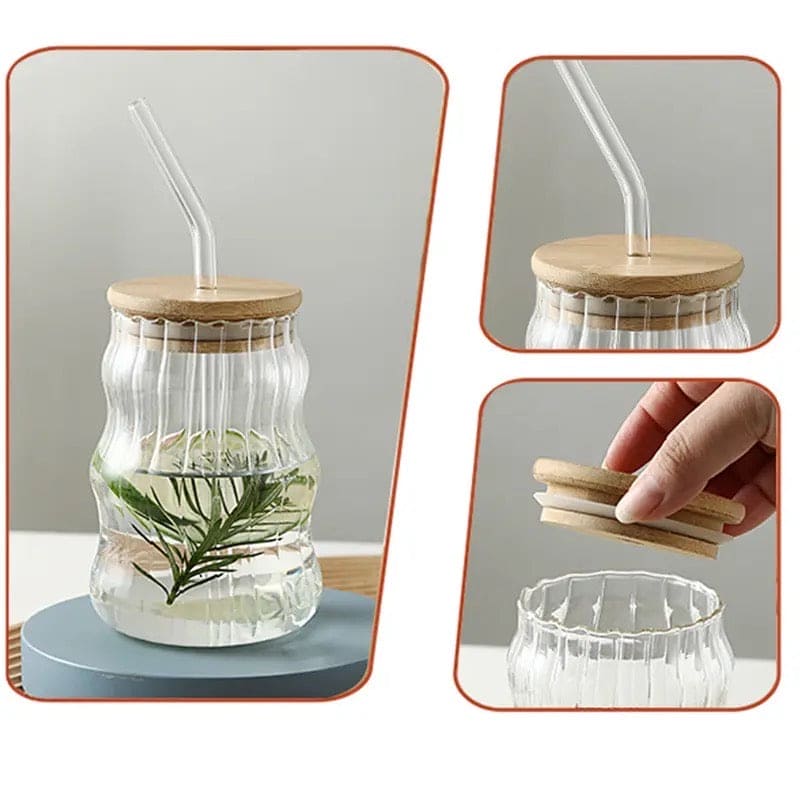 Clear glass mug with bamboo lid glass mug with straw and decorative greenery inside