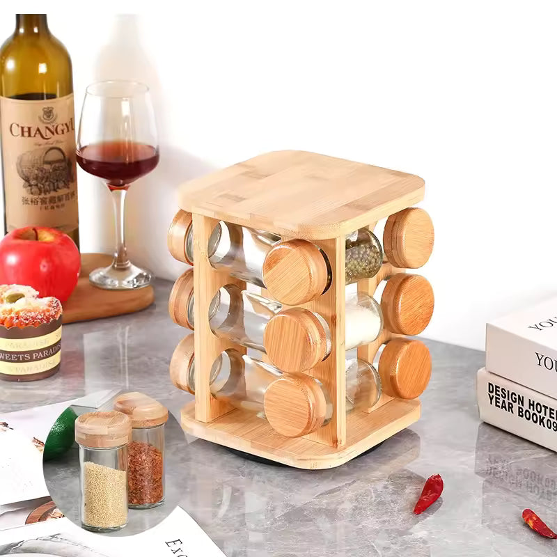Clarify.pk bamboo spice rack organizer with twelve glass jars and wooden lids on kitchen countertop