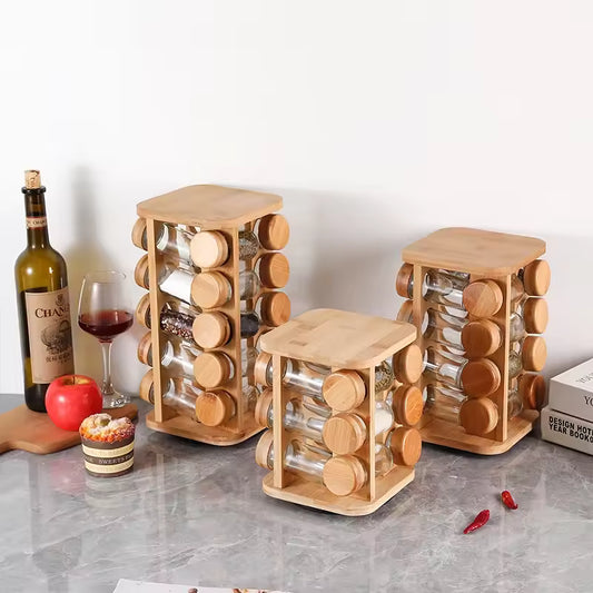 Clarify.pk bamboo spice rack organizer set with multiple glass jars and wooden lids on kitchen countertop