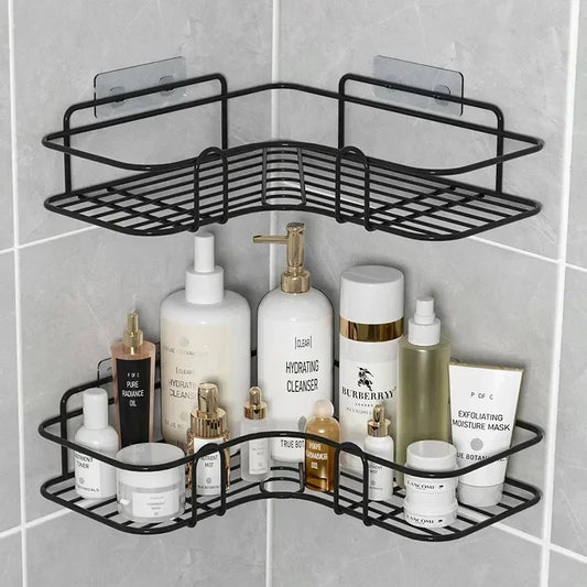 Black bathroom corner shelf wall mounted holding skincare bottles and beauty products in tiled shower corner
