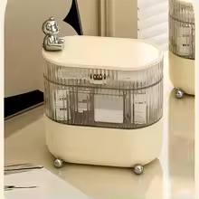 Clarify.pk 360 degree jewelry organizer with transparent compartments and cream base on dressing table