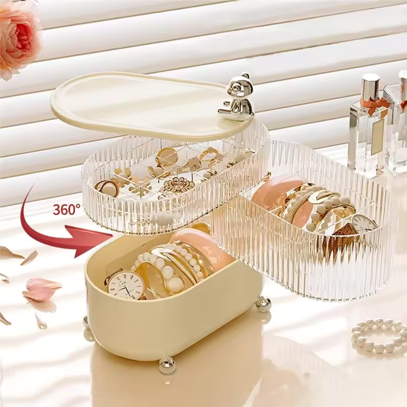 Clarify.pk 360 degree jewelry organizer with rotating compartments holding bracelets rings and watch