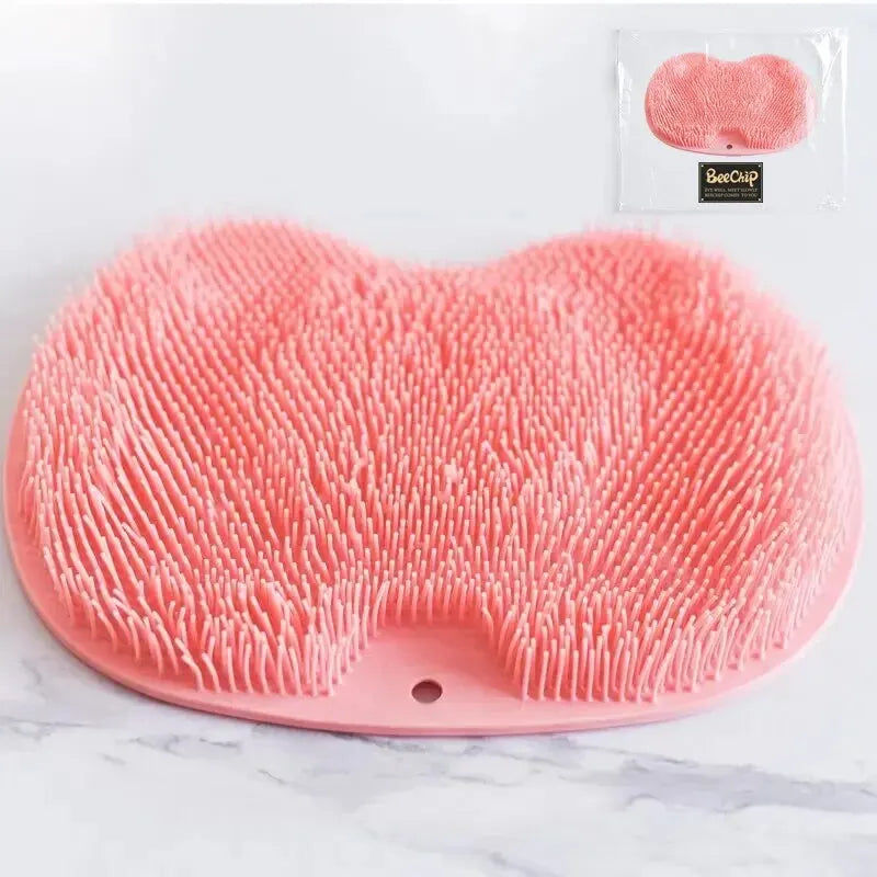 Pink silicone foot scrubber pad with soft bristles for gentle exfoliation and cleaning