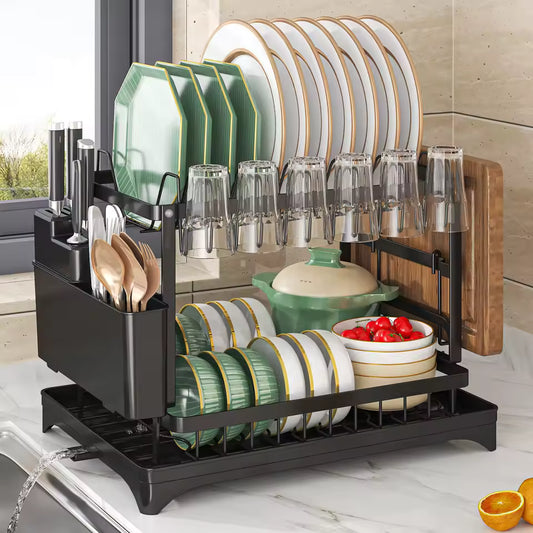 Clarify.pk 2 tier dish drying rack in black holding plates, glasses, bowls, and utensils on kitchen counter