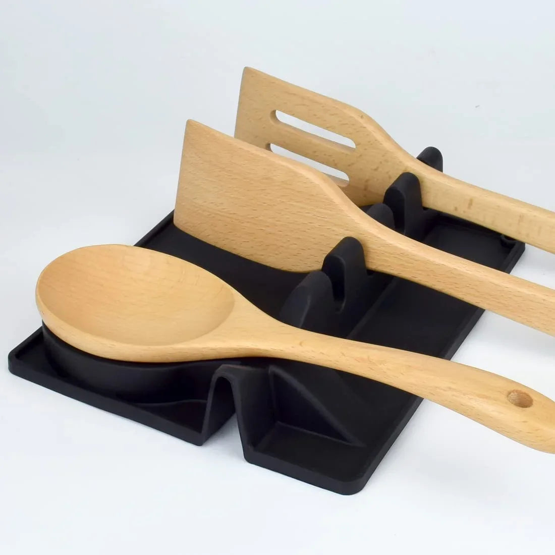 Clarify.pk black kitchen spoon holder with three wooden cooking utensils organized neatly