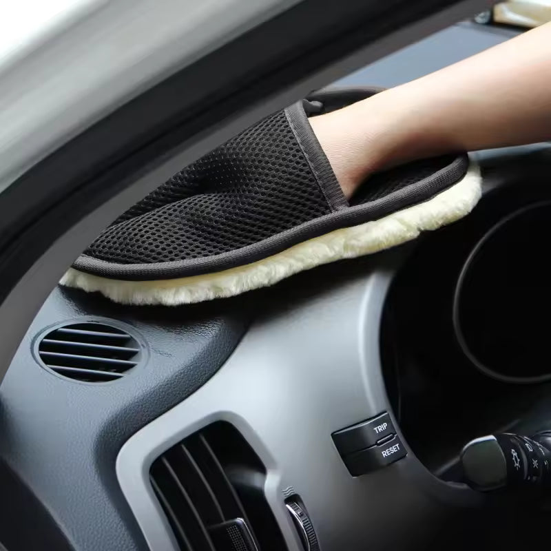 Clarify.pk black car washing gloves with soft cleaning surface used on car dashboard