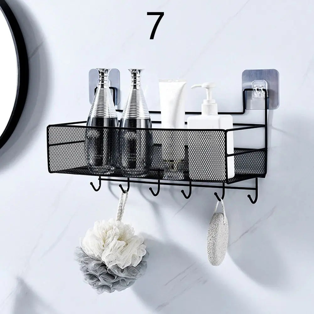 Black metal wall mounted bathroom shelf with hooks holding bottles and bath accessories