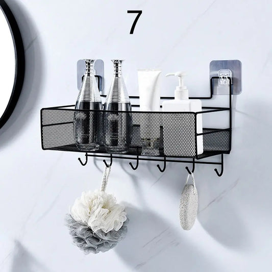 Black metal wall mounted bathroom shelf with hooks holding bottles and bath accessories