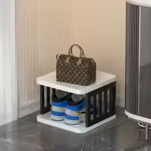 Compact 5 layer shoe storage organizer by Clarify.pk holding shoes and handbag in white and black