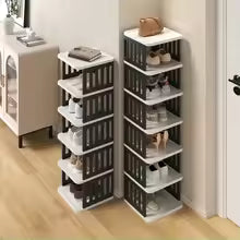 Clarify.pk 5 layer shoe storage organizer with black and white shelves holding multiple shoes in a modern home