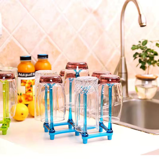Clarify.pk blue glass cup drying rack holding multiple inverted clear glasses on kitchen counter