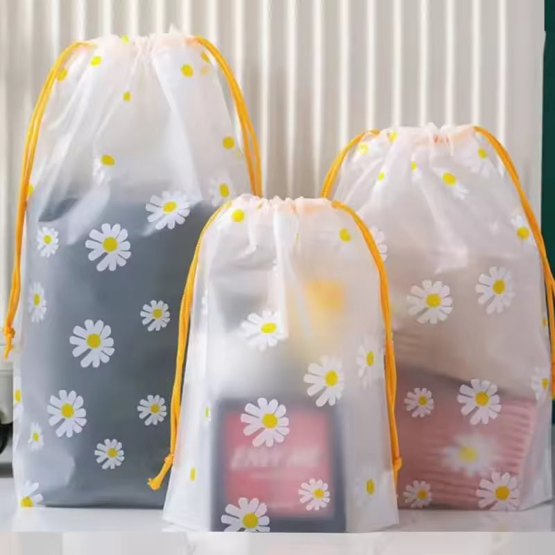 Clarify.pk 4 piece travel storage bags with daisy print and yellow drawstrings for organized packing
