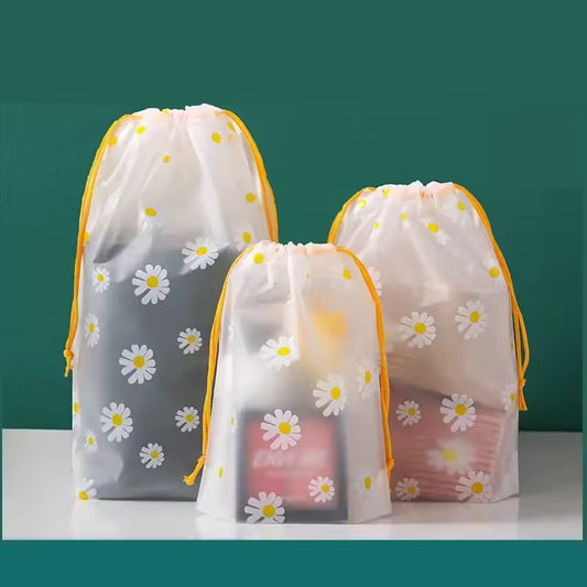 Clarify.pk 4 piece travel storage bags with daisy pattern and yellow drawstrings for organized packing