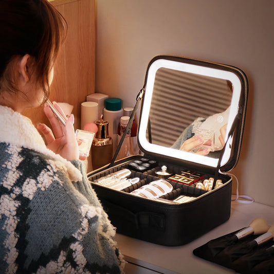Smart LED makeup case with mirror open on vanity table holding makeup items and brushes
