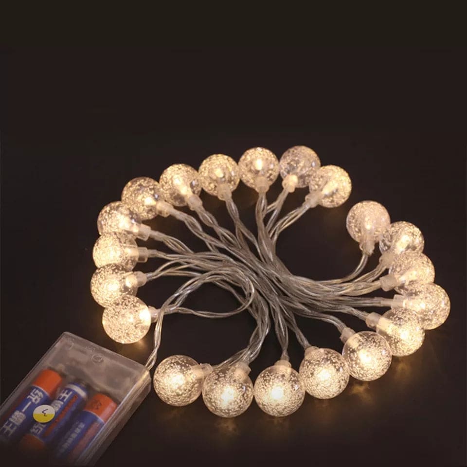Warm white bubble ball LED string lights with textured spheres powered by batteries