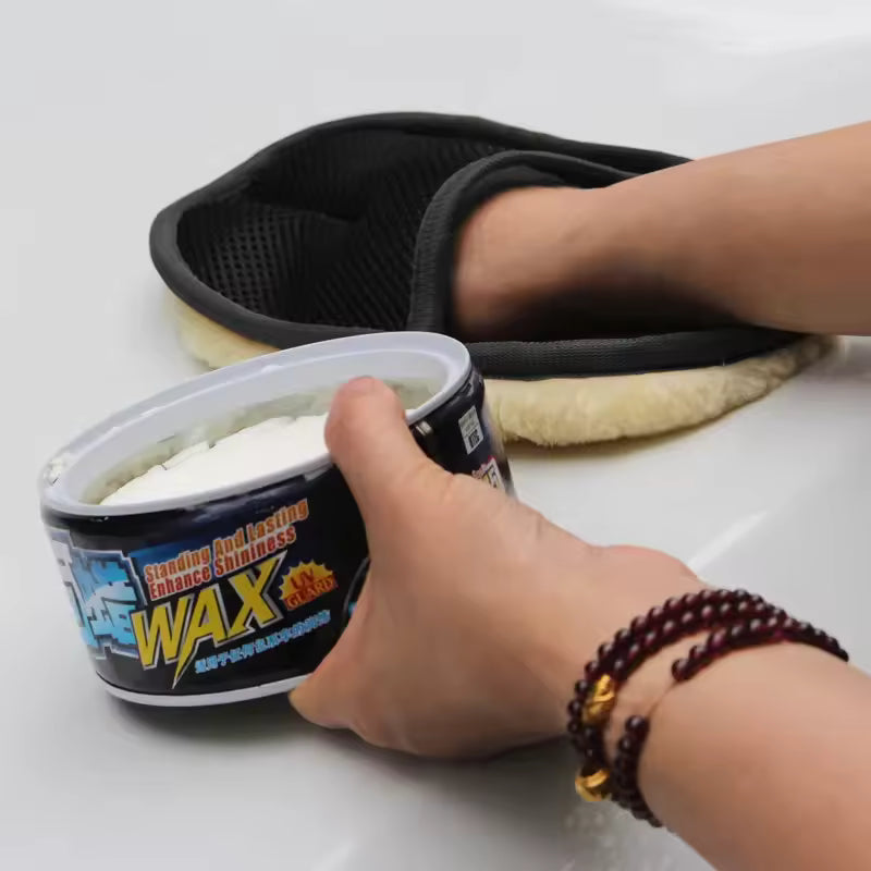 Clarify.pk car washing gloves being used to apply wax on a car surface for a shiny finish